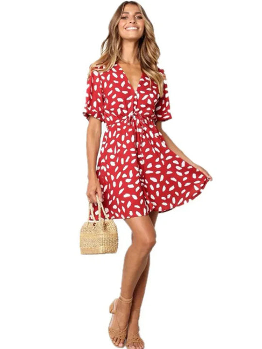 Zomerdress met diepe V-hals en tailleband