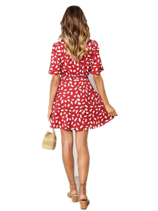 Zomerdress met diepe V-hals en tailleband
