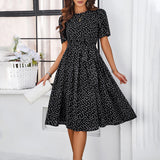 Elegante dames midi jurk met stippen en strik
