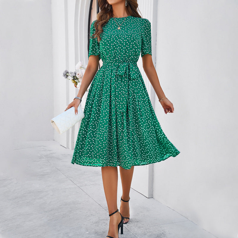 Elegante dames midi jurk met stippen en strik
