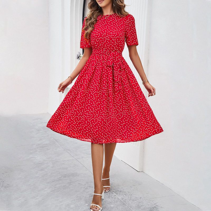 Elegante dames midi jurk met stippen en strik