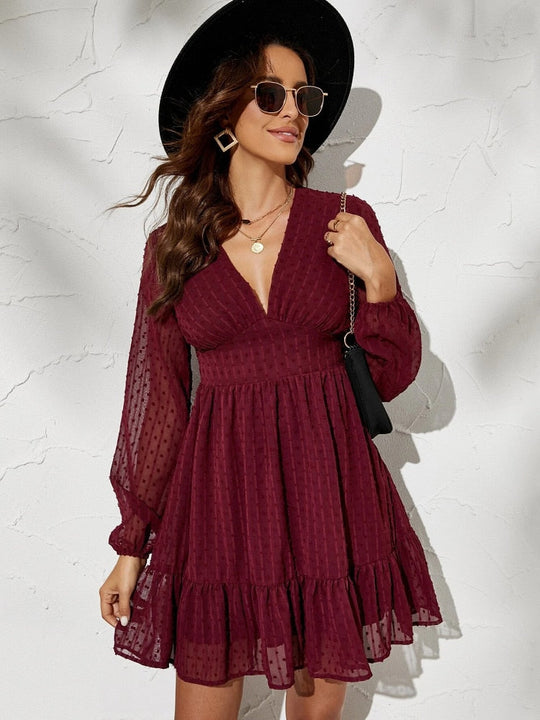 Jurk met Lange, Transparante Mouwen en Ruffles