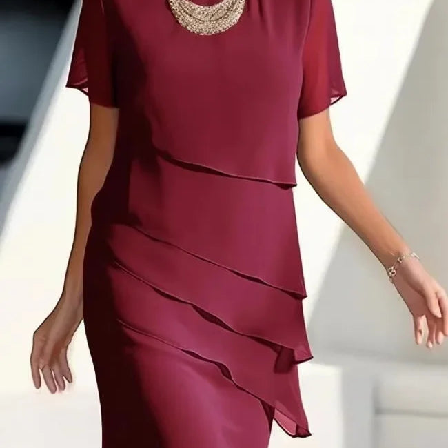 Elegante dameslagenjurk met korte mouwen