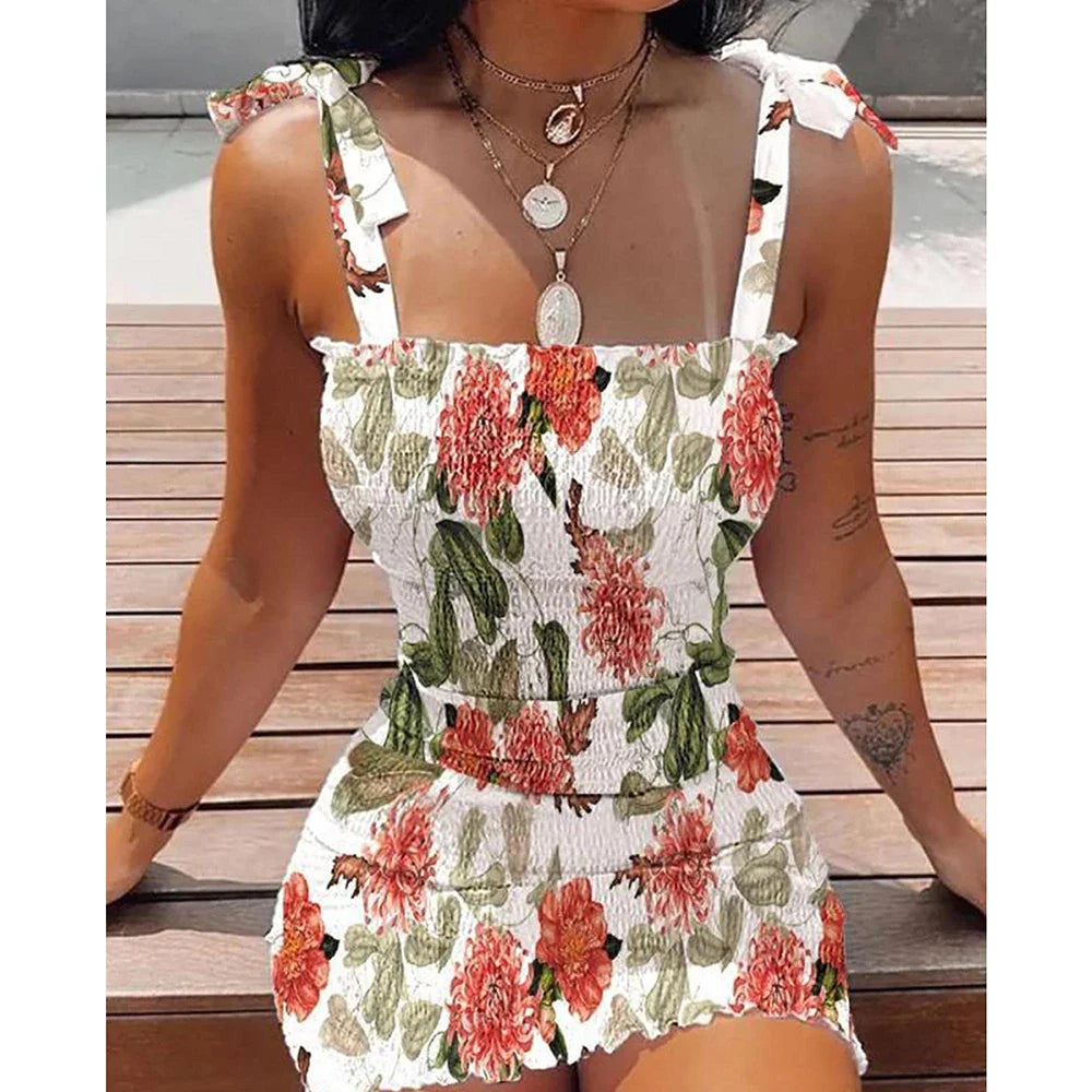 Mini-jurk met bloemen en strikbandjes