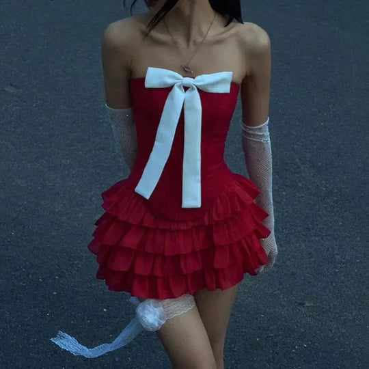 Schattige cocktailjurk met ruffles en grote strik