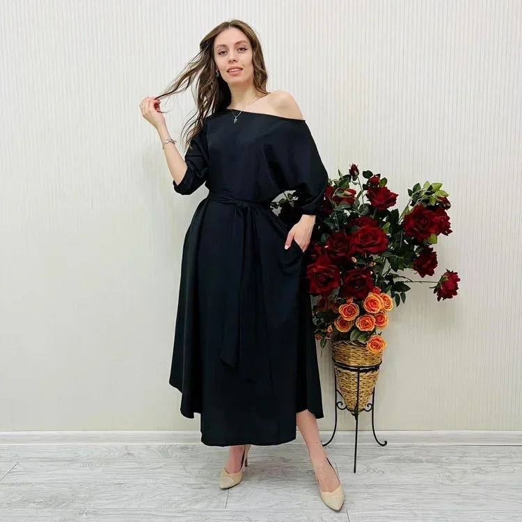 Elegante dames midi-jurk met blote schouder en riem