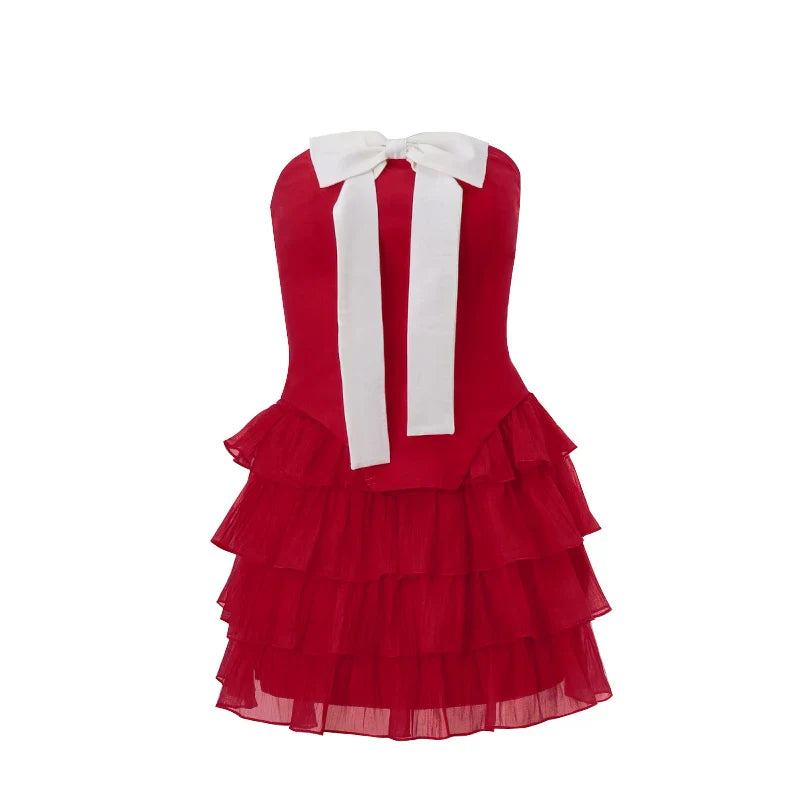 Schattige cocktailjurk met ruffles en grote strik