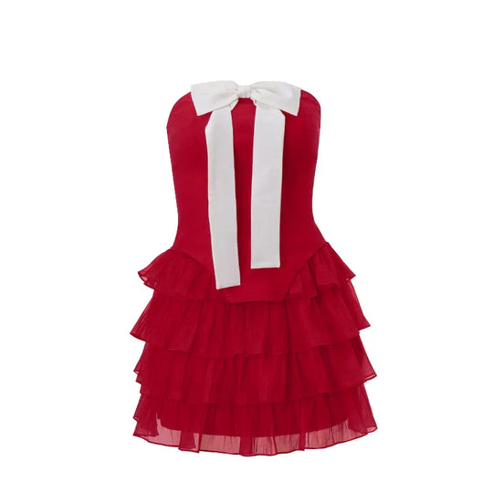 Schattige cocktailjurk met ruffles en grote strik