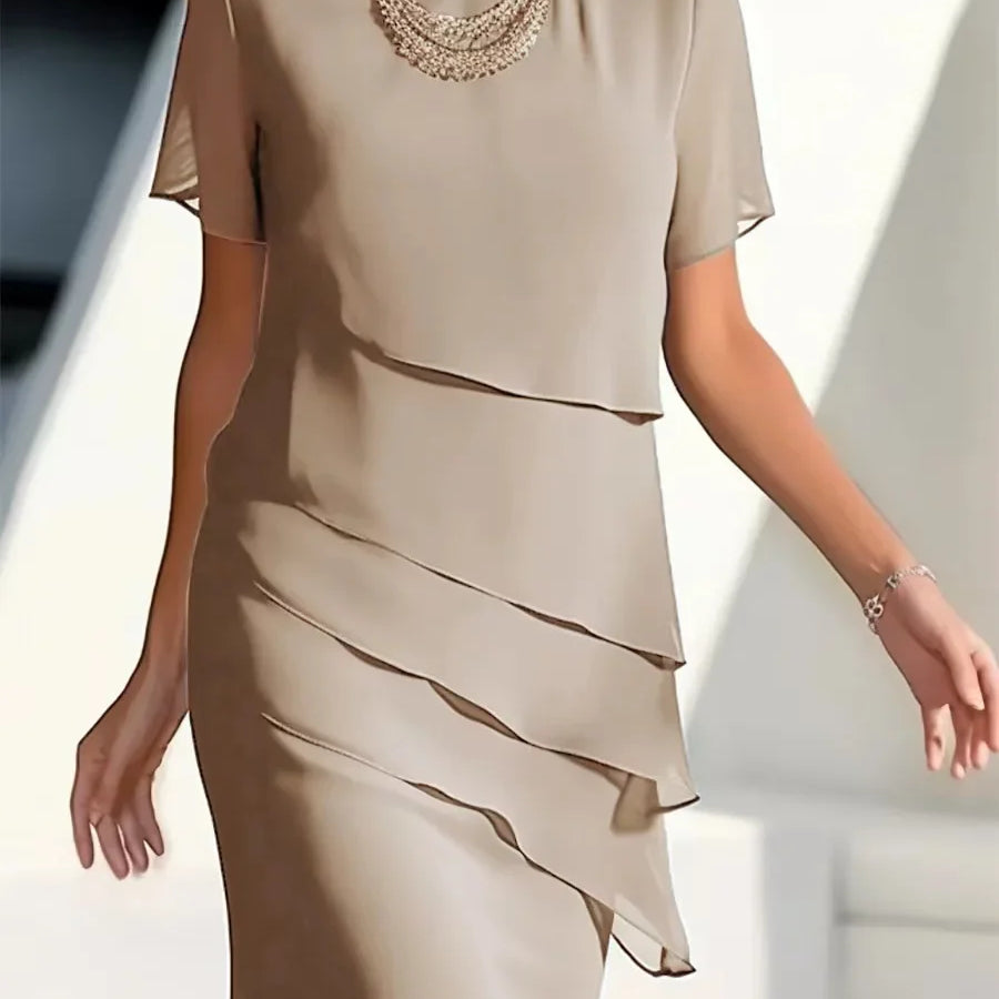 Elegante dameslagenjurk met korte mouwen
