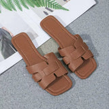 Stijlvolle dames sandalen met platte zool en gekruiste banden
