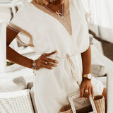 Elegante damesjurk met decoratieve details