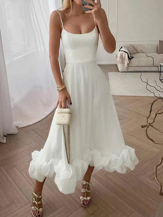 Elegante jurk met spaghettibandjes en ruffles