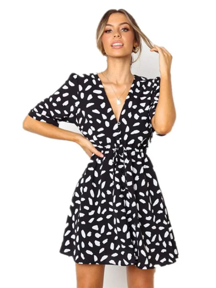 Zomerdress met diepe V-hals en tailleband