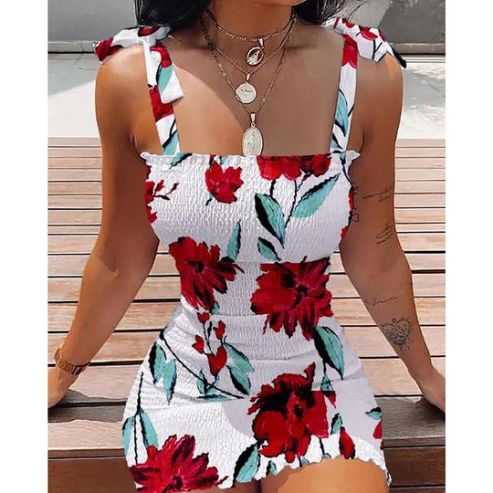 Mini-jurk met bloemen en strikbandjes