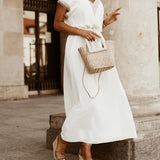 Elegante damesjurk met decoratieve details