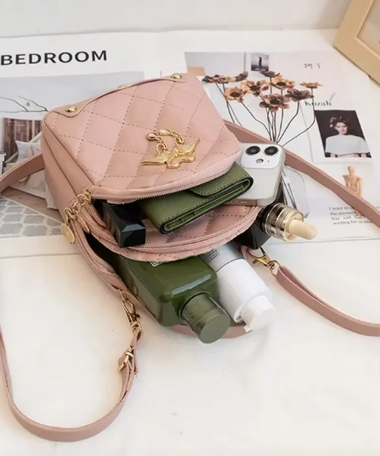 Kleine damesschoudertas met een decoratief flamingomotief