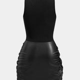 Knoop Voorkant Mouwloze Mini Jurk – Edgy en Elegant in Eén Look