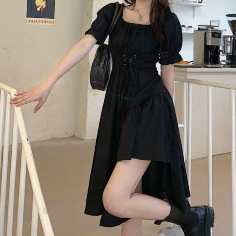 Dames asymmetrische jurk met pofmouwen en strik in de taille